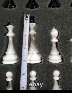 Chess Set. Leather board, heavy plastic pieces